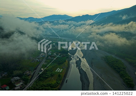 An aerial photograph capturing the village of Tanoguchi in Shizuoka Prefecture and the mountain range of Oigawa and Asagiri. An aerial photograph capturing the village of Tanoguchi in Shizuoka Prefecture and the mountain range of Oigawa and Asagiri. 141225022