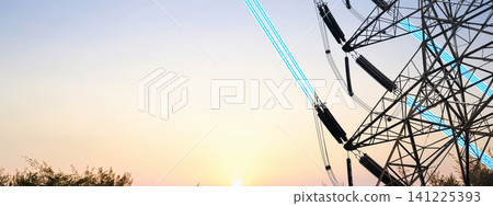 Silhouette of a high voltage electricity pylon with glowing blue digital light beams on power lines against a dramatic colorful sunset sky. Concept of smart grid and future energy Silhouette of a high voltage electricity pylon with glowing blue digital light beams on power lines against a dramatic colorful sunset sky. Concept of smart grid and future energy 141225393