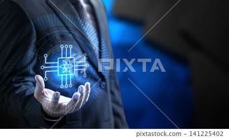A business professional in a suit holding a glowing blue quantum processor digital interface symbol in their hands, representing advanced technology, innovation, and computing solutions A business professional in a suit holding a glowing blue quantum processor digital interface symbol in their hands, representing advanced technology, innovation, and computing solutions 141225402