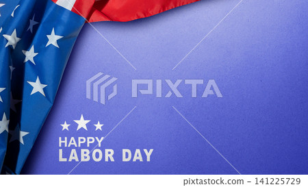 A patriotic Happy Labor Day card featuring the USA flag draped over a textured blue background with stars and greeting text 141225729