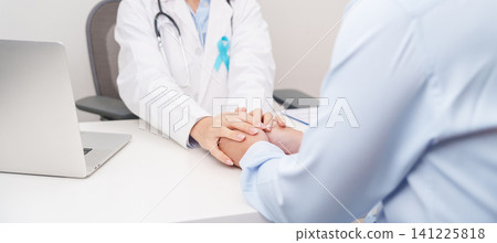 doctor holding patient hand to comfort and support with empathy. blue Ribbon concept of November Prostate Cancer Awareness month, Diabetes day , Men Health, International men, Father day 141225818