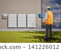 Asian engineer or technician with battery energy storage system for residential used 141226012