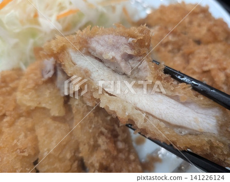 The image of a hearty, freshly made chicken cutlet set meal enjoyed in a cafeteria. The image of a hearty, freshly made chicken cutlet set meal enjoyed in a cafeteria. 141226124
