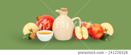 Bright apples and pomegranates arranged with honey and a jug Bright apples and pomegranates arranged with honey and a jug 141226326