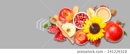 Fresh fruits including apples and pomegranates arranged with honey Fresh fruits including apples and pomegranates arranged with honey 141226328
