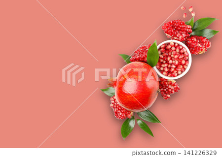 Pomegranate fruit and its seeds arranged artistically with leaves Pomegranate fruit and its seeds arranged artistically with leaves 141226329