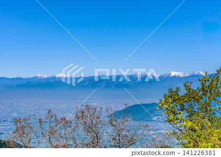 A panoramic view of the Kofu Basin and the Southern Alps from the summit of Mt. Genjiro. A panoramic view of the Kofu Basin and the Southern Alps from the summit of Mt. Genjiro. 141226381