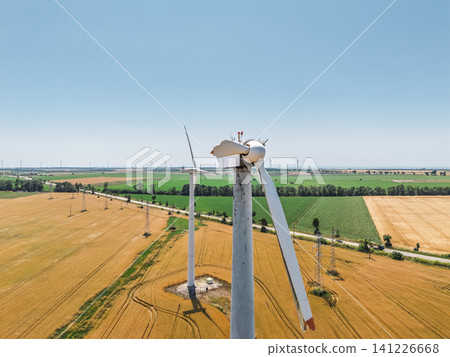 Wind energy system failure. broken blade hanging from turbine. European Green Energy Fund Wind energy system failure. broken blade hanging from turbine. European Green Energy Fund 141226668