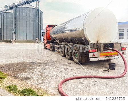 Industrial Tanker Truck Loading at Agricultural Silo Facility Industrial Tanker Truck Loading at Agricultural Silo Facility 141226715