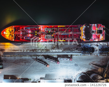 Aerial View of Port Tanker and Grain Silos. High oleic sunflower oil is loaded from tanker trucks onto a tanker 141226726