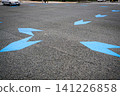 Blue arrow markings (bicycle lane) at intersections. 141226858