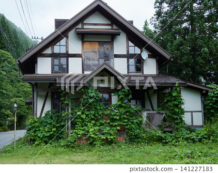 A scene of a closed-down hotel in the Okuhida Onsen hot spring resort town on a rainy summer day. A scene of a closed-down hotel in the Okuhida Onsen hot spring resort town on a rainy summer day. 141227183