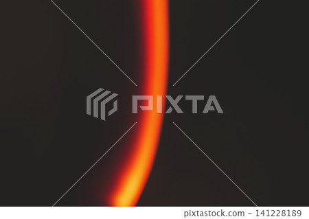 Sleek minimalist red and orange light streak over dark background with smooth gradient glow Sleek minimalist red and orange light streak over dark background with smooth gradient glow 141228189