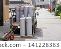 LP gas delivery truck working in a residential area 141228363