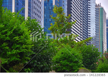 Modern eco city skyscrapers with green trees in Batumi with copy space Modern eco city skyscrapers with green trees in Batumi with copy space 141228365