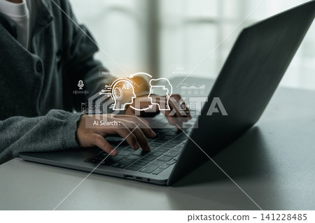 Person using laptop computer with artificial intelligence digital interface showing AI search technology and virtual machine learning concept illustration Person using laptop computer with artificial intelligence digital interface showing AI search technology and virtual machine learning concept illustration 141228485