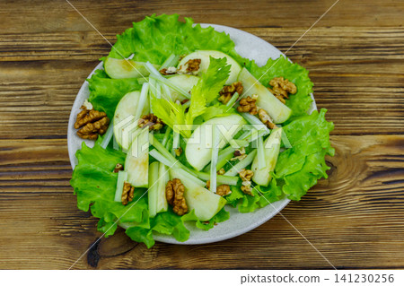 Waldorf salad on a wooden table. Top view 141230256