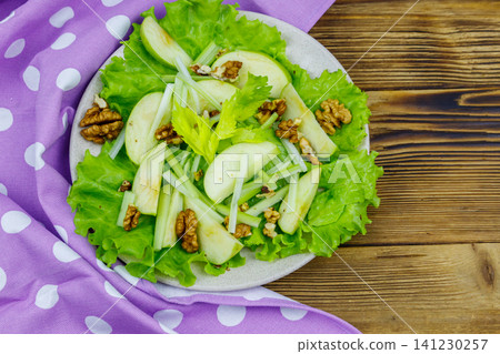 Waldorf salad on a wooden table. Top view Waldorf salad on a wooden table. Top view 141230257