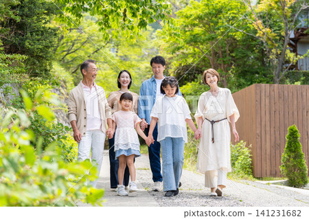 An image of a family taking a walk together across three generations. An image of a family taking a walk together across three generations. 141231682