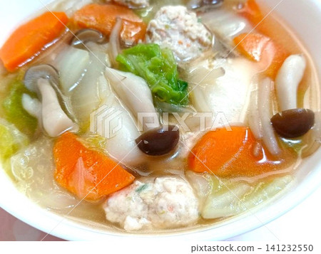 Homemade chicken meatball soup with lots of ingredients Homemade chicken meatball soup with lots of ingredients 141232550