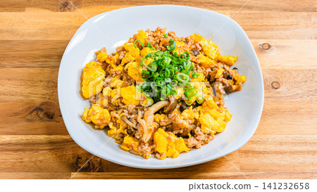 Mapo Egg: Chinese-style egg stir-fry with minced meat and shimeji mushrooms. Mapo Egg: Chinese-style egg stir-fry with minced meat and shimeji mushrooms. 141232658