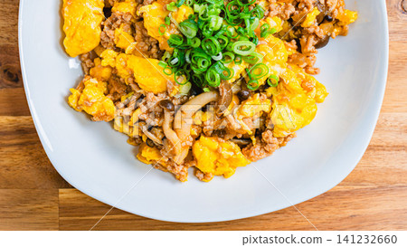 Mapo Egg: Chinese-style egg stir-fry with minced meat and shimeji mushrooms. Mapo Egg: Chinese-style egg stir-fry with minced meat and shimeji mushrooms. 141232660