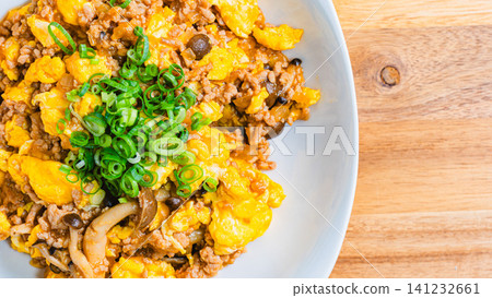 Mapo Egg: Chinese-style egg stir-fry with minced meat and shimeji mushrooms. Mapo Egg: Chinese-style egg stir-fry with minced meat and shimeji mushrooms. 141232661