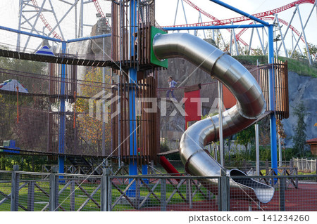 Modern Adventure Playground With Spiral Slide And Exciting Climbing Structures Outdoors Modern Adventure Playground With Spiral Slide And Exciting Climbing Structures Outdoors 141234260