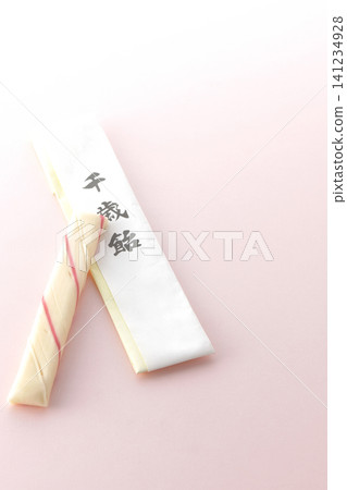 Chitose-ame candy photographed against a pink background. Chitose-ame candy photographed against a pink background. 141234928