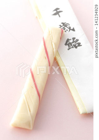 Chitose-ame candy photographed against a pink background. Chitose-ame candy photographed against a pink background. 141234929