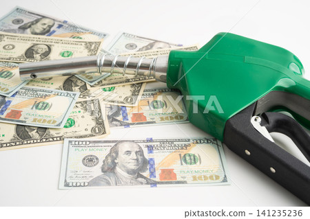 Gas pump, Fuel Nozzle with dollar money for cost energy. Gas pump, Fuel Nozzle with dollar money for cost energy. 141235236