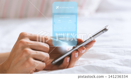Travel booking on a smartphone showing a digital boarding pass for a flight in June 141236334