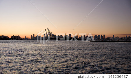 Miami Downtown Skyline Reflecting in the Water at Sunset Miami Downtown Skyline Reflecting in the Water at Sunset 141236487
