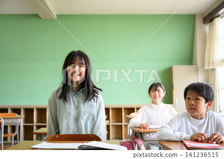 Elementary school students smiling in the classroom Elementary school students smiling in the classroom 141236515