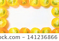 A frame of colorful tomatoes against a white background. 141236866