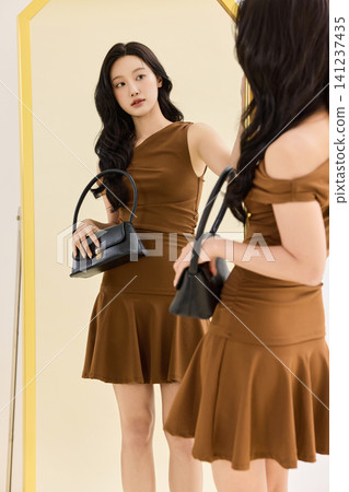 Asian woman preparing an outfit before going out 141237435