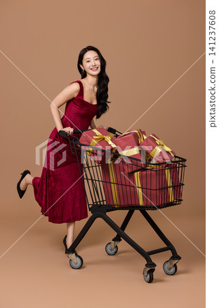 Holiday sale concept with a cart full of presents Holiday sale concept with a cart full of presents 141237608