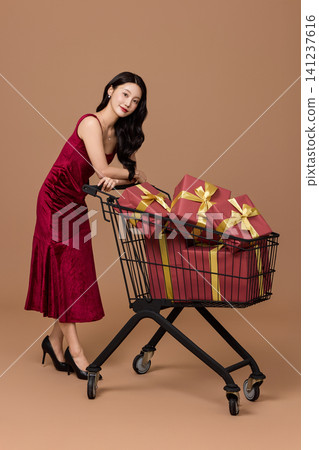 Elegant woman shopping with gift boxes and bags 141237616