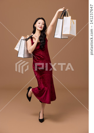 Asian woman showing a membership card after shopping Asian woman showing a membership card after shopping 141237647