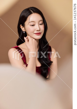 Celebration portrait with gold balloons and wine glass Celebration portrait with gold balloons and wine glass 141237676