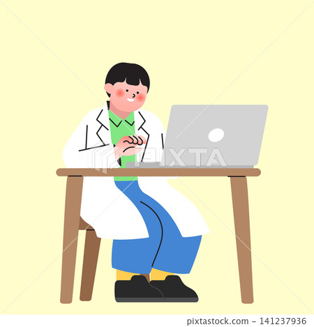 A person wearing a white coat is sitting at a wooden table. They are focused on typing on a laptop. The background is a plain light color. It is daytime. 141237936