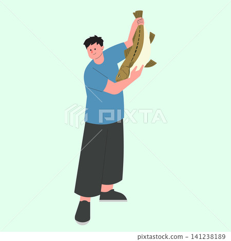 A person stands with a big fish in their hands after fishing. They are smiling and appear happy in this moment of celebration outdoors. 141238189