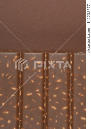 Milk chocolate bar with puffed rice detail Milk chocolate bar with puffed rice detail 141238777