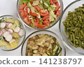 Assorted Vegetarian Dishes in Glass Bowls Top View 141238797