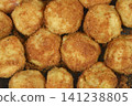 Traditional potato dumplings coated in fried breadcrumbs close up view 141238805