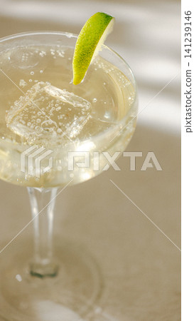 Sparkling lime cocktail macro with ice bubbles and bright citrus garnish. Sparkling lime cocktail macro with ice bubbles and bright citrus garnish. 141239146