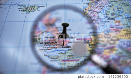 Exploring London revealed through a magnifying glass on a map 141239290