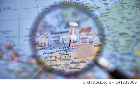 Close up of a magnifying glass over a map highlighting Klaipeda 141239309