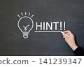 A person's hand underlining the hint letters 141239347