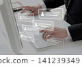 Businesspeople who use computers to analyze and manage customer information 141239349